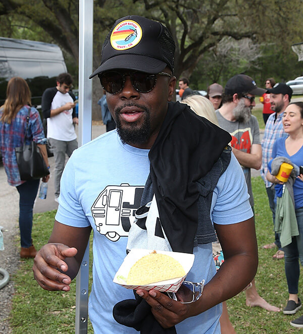 AUSTIN, TX - MARCH 18: Wyclef Jean eats a taco at the GQ Jam In The Van Artist House sponsored by Hormel Taco Meats on March 18, 2016 in Austin, Texas. (Photo by Gary Miller/Getty Images for GQ Jam In The Van)